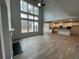 Open living room with high ceilings, fireplace and kitchen views at 255 Arwen Dr, Mcdonough, GA 30252