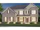 Two story home exterior at night, featuring brick and siding accents, and a welcoming front porch at 255 Arwen Dr, Mcdonough, GA 30252