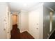 Clean and bright entryway with dark brown wood-look flooring at 5555 Mountain Springs Cir, Stone Mountain, GA 30088