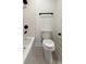 Clean bathroom featuring a bathtub, toilet and tiled floor at 270 Crosstree Ln, Atlanta, GA 30328