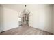 Bright dining room features hardwood floors and a unique chandelier at 270 Crosstree Ln, Atlanta, GA 30328