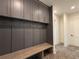 Mudroom with built-in bench, hooks, and gray cabinets at 270 Crosstree Ln, Atlanta, GA 30328