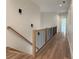 Upstairs hallway with hardwood floors and modern railing at 270 Crosstree Ln, Atlanta, GA 30328
