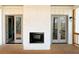 Back porch with an outdoor fireplace and French doors at 270 Crosstree Ln, Atlanta, GA 30328