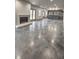 Large open basement with polished concrete floors and fireplace at 270 Crosstree Ln, Atlanta, GA 30328