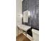 Stylish powder room with patterned wall tile at 270 Crosstree Ln, Atlanta, GA 30328