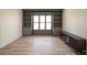 Home office with built-in shelving and hardwood floors at 270 Crosstree Ln, Atlanta, GA 30328