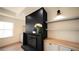 Modern fireplace with built-in shelving and wood flooring at 270 Crosstree Ln, Atlanta, GA 30328
