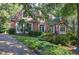 Brick home with lush landscaping and welcoming front porch at 14 Mckelvey Nw Ct, Cartersville, GA 30121