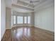 Spacious main bedroom with hardwood floors and tray ceiling at 14 Mckelvey Nw Ct, Cartersville, GA 30121