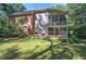 Two-story house with a screened porch and deck, surrounded by trees at 14 Mckelvey Nw Ct, Cartersville, GA 30121