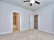Main bedroom with carpet, ceiling fan and access to bathroom and closet at 6120 Ripple Way # 46, South Fulton, GA 30349