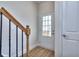 Interior entryway with wood stairs and white door at 6120 Ripple Way # 46, South Fulton, GA 30349