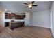 Open concept living room and kitchen with hardwood floors and ceiling fan at 6120 Ripple Way # 46, South Fulton, GA 30349