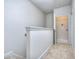 Upstairs hallway with access to laundry and additional rooms at 6120 Ripple Way # 46, South Fulton, GA 30349