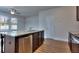 Modern kitchen with granite countertops, stainless steel appliances, and dark wood cabinets at 6120 Ripple Way # 46, South Fulton, GA 30349