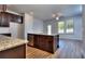 Modern kitchen with island and stainless steel appliances at 6120 Ripple Way # 46, South Fulton, GA 30349