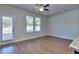 Bright living room with hardwood floors, sliding glass door, and neutral walls at 6120 Ripple Way # 46, South Fulton, GA 30349