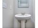 Simple pedestal sink bathroom with a rectangular mirror at 6120 Ripple Way # 46, South Fulton, GA 30349
