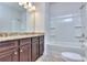 Bathroom with granite countertop, double vanity and shower/tub at 6104 Ripple Way # 50, South Fulton, GA 30349