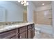 Bathroom with granite countertop, double vanity and tub at 6104 Ripple Way # 50, South Fulton, GA 30349