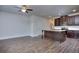 Open living room and kitchen with hardwood floors and ceiling fan at 6104 Ripple Way # 50, South Fulton, GA 30349