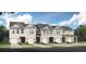 Exterior view of five townhouses with attached garages and landscaping at 6104 Ripple Way # 50, South Fulton, GA 30349