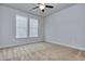 Spacious bedroom with neutral walls, ceiling fan and carpet at 6104 Ripple Way # 50, South Fulton, GA 30349