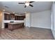 Open living room and kitchen with hardwood floors and ceiling fan at 6104 Ripple Way # 50, South Fulton, GA 30349