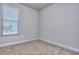 Simple bedroom with carpeted floor and window with blinds at 6116 Ripple Way # 47, South Fulton, GA 30349