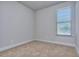Simple bedroom with neutral wall paint and carpet at 6116 Ripple Way # 47, South Fulton, GA 30349