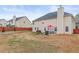 Large backyard with patio, grill, and seating area at 3756 Bondurant Dr, Douglasville, GA 30135