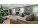 Relaxing Gathering room with sectional sofa, fireplace, and hardwood floors at 3756 Bondurant Dr, Douglasville, GA 30135
