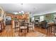 Casual dining area with a glass-top table and four chairs, adjacent to the kitchen at 3756 Bondurant Dr, Douglasville, GA 30135