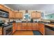 Modern kitchen featuring stainless steel appliances and light wood cabinets at 3756 Bondurant Dr, Douglasville, GA 30135