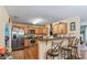 Kitchen with breakfast bar, stainless steel appliances, and wood flooring at 3756 Bondurant Dr, Douglasville, GA 30135