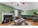 Comfortable Gathering room featuring a fireplace and hardwood floors at 3756 Bondurant Dr, Douglasville, GA 30135