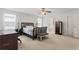 Main bedroom with carpeted floor, king-size bed, and ensuite bathroom at 3756 Bondurant Dr, Douglasville, GA 30135