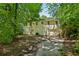 Back of the house showcasing a double garage and mature trees at 1886 S Gordon Sw St, Atlanta, GA 30310