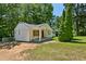 Charming white brick ranch house with a covered porch and large backyard at 1886 S Gordon Sw St, Atlanta, GA 30310