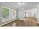 Bright dining room with hardwood floors and view into kitchen at 1886 S Gordon Sw St, Atlanta, GA 30310