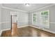 Bright dining room with hardwood floors and kitchen view at 1886 S Gordon Sw St, Atlanta, GA 30310
