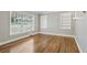 Living room with hardwood floors, built-in shelves, and neutral walls at 1886 S Gordon Sw St, Atlanta, GA 30310