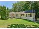 Brick house with a covered porch and manicured lawn at 1886 S Gordon Sw St, Atlanta, GA 30310