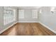 Spacious living room featuring hardwood floors and built-in shelving at 1886 S Gordon Sw St, Atlanta, GA 30310