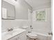 Clean bathroom with white tile, bathtub, and updated vanity at 1886 S Gordon Sw St, Atlanta, GA 30310