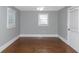 Simple bedroom with hardwood floors and neutral walls at 1068 N Main Nw St, Conyers, GA 30012