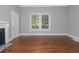 Hardwood floors and two windows with blinds at 1068 N Main Nw St, Conyers, GA 30012
