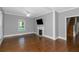 Spacious living room with hardwood floors, fireplace and view to staircase at 1068 N Main Nw St, Conyers, GA 30012