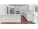 White kitchen with stainless steel appliances and island at 1068 N Main Nw St, Conyers, GA 30012